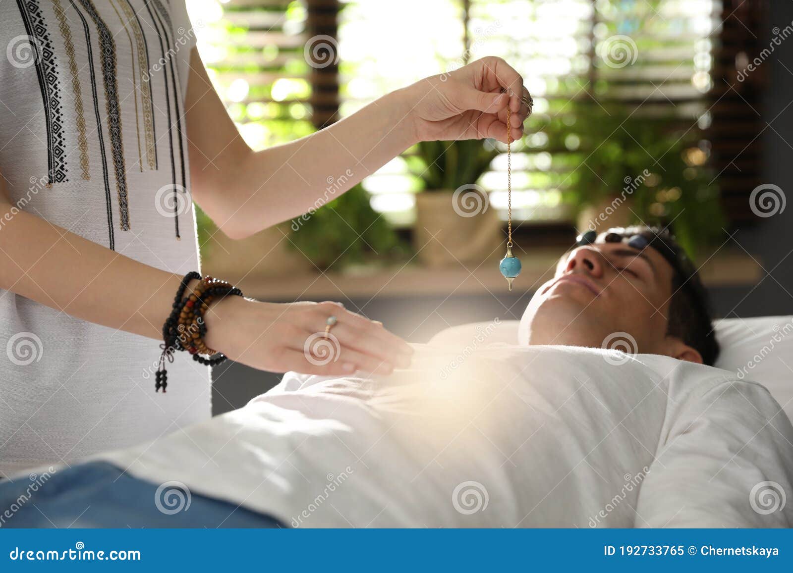 Man during Crystal Healing Session in Room Stock Image Image of palm