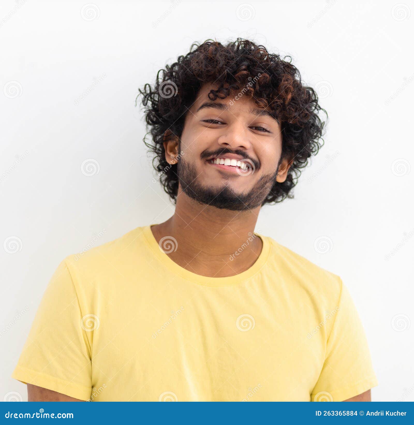 Man With Curly Hair And Happy Smile. Young Indian Male Student Smiling  Joyfully Standing On A White Background Stock Photo - Image Of Background,  Charming: 263365884