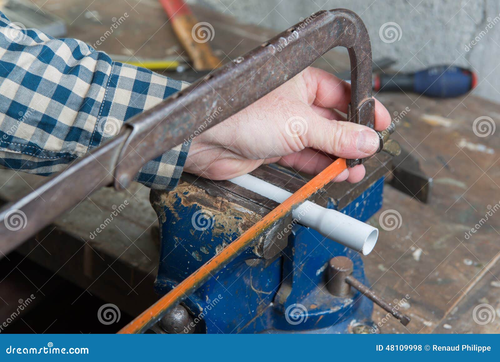 Man cut PVC pipe stock photo. Image of handsaw, work 48109998