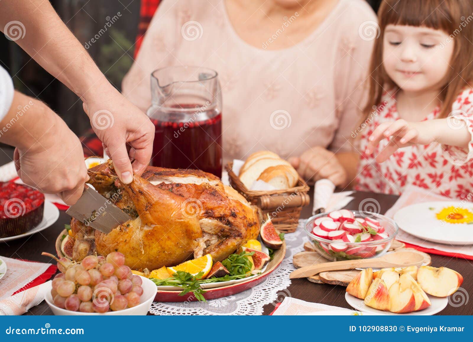 A Man Cuts Off a Piece of Roast Turkey at the Table Stock Photo - Image ...