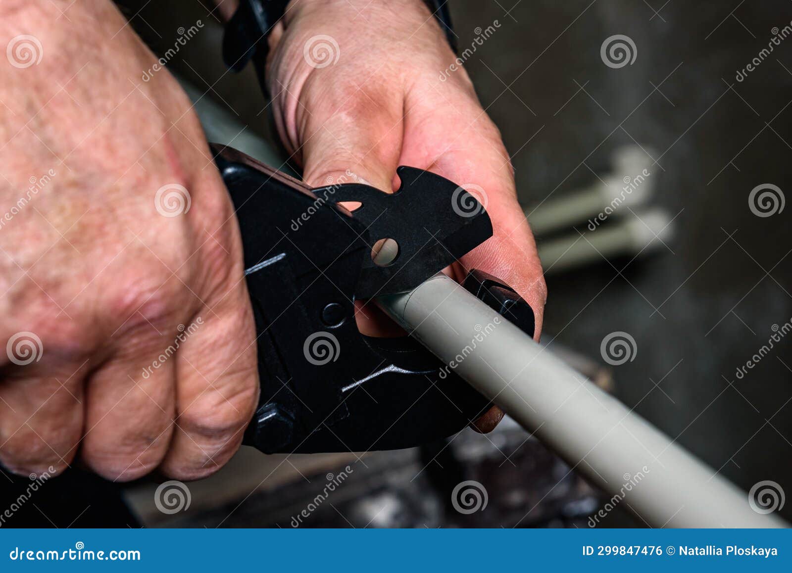 Man Cutting Plastic Pipe Watering Pipes Using Professional Scissors