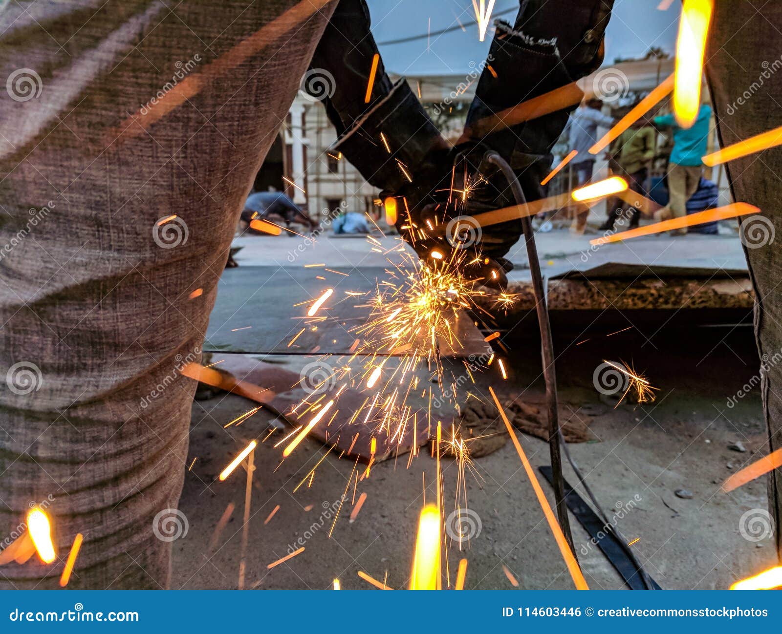 Man Cutting Steel Using A Power Tool Picture. Image: 114603446