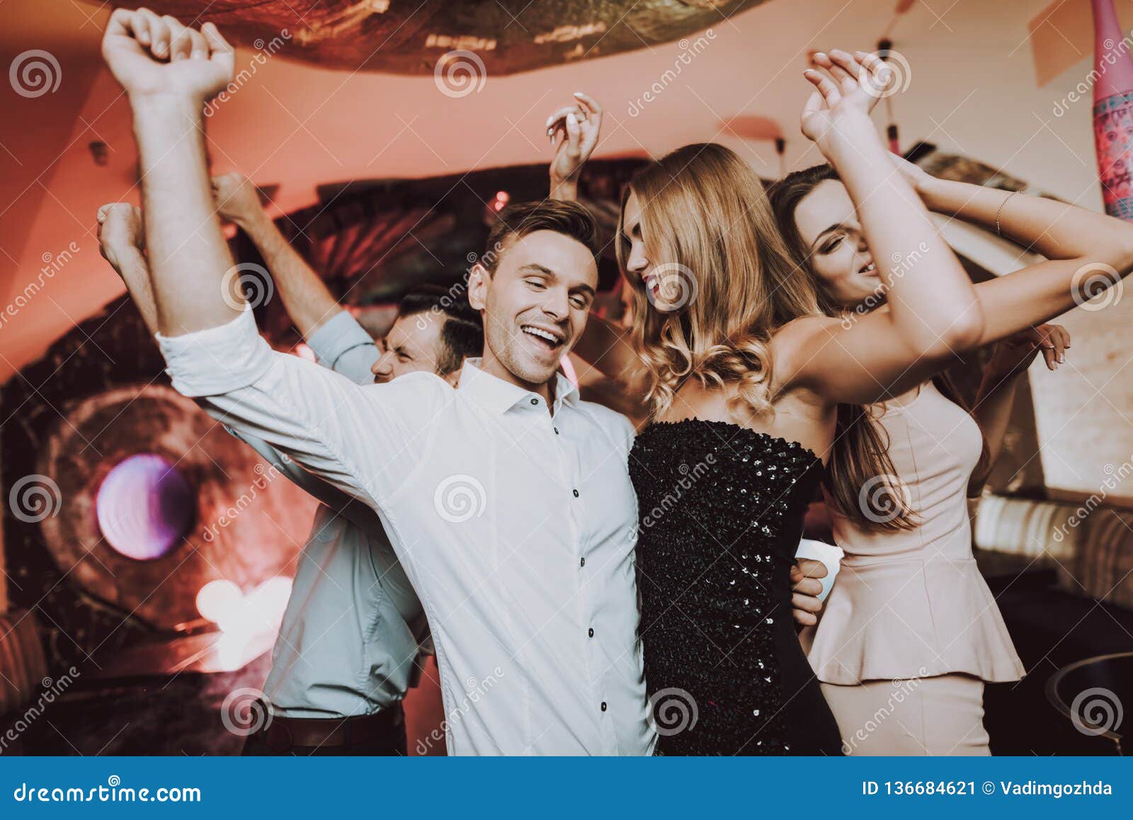 Man Dancing with Woman.Foreground.Singing Friends. Stock Image - Image ...