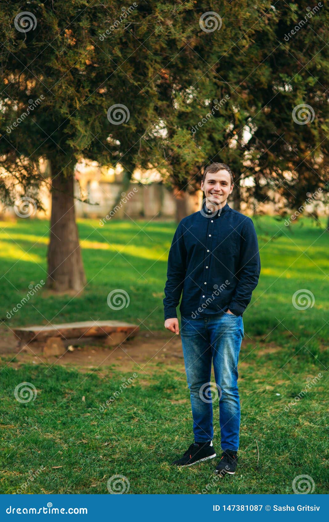 Man in Dark Blue Shirt Standing in the Park Stock Image - Image of ...