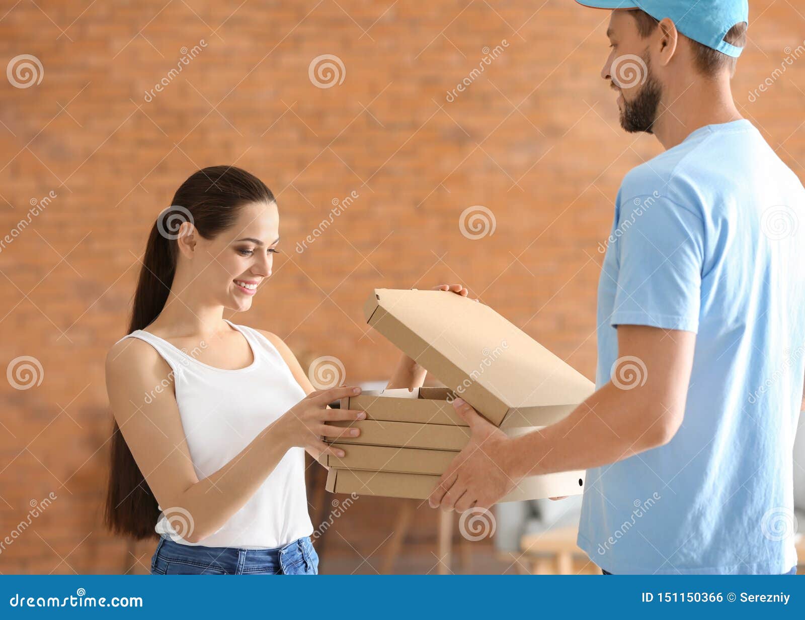 Man Delivering Pizza To Customer Indoors Stock Photo Image of service