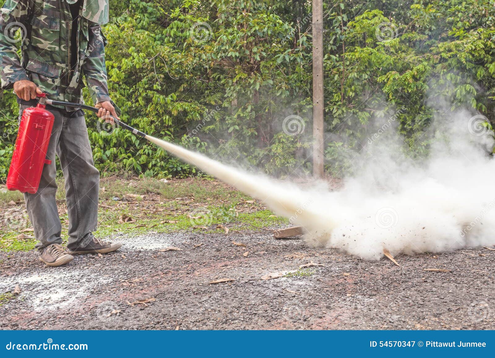 a man demonstrating how to use a fire extinguisher