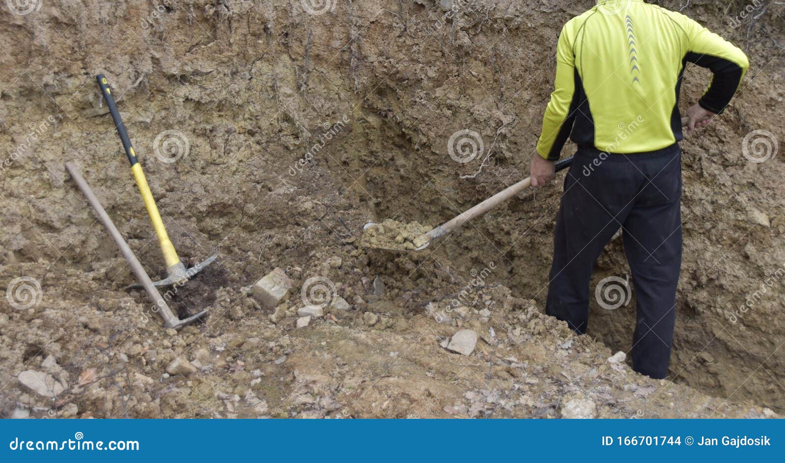 A Man Digging a Hole with a Shovel, Removing the Soil with the Shovel