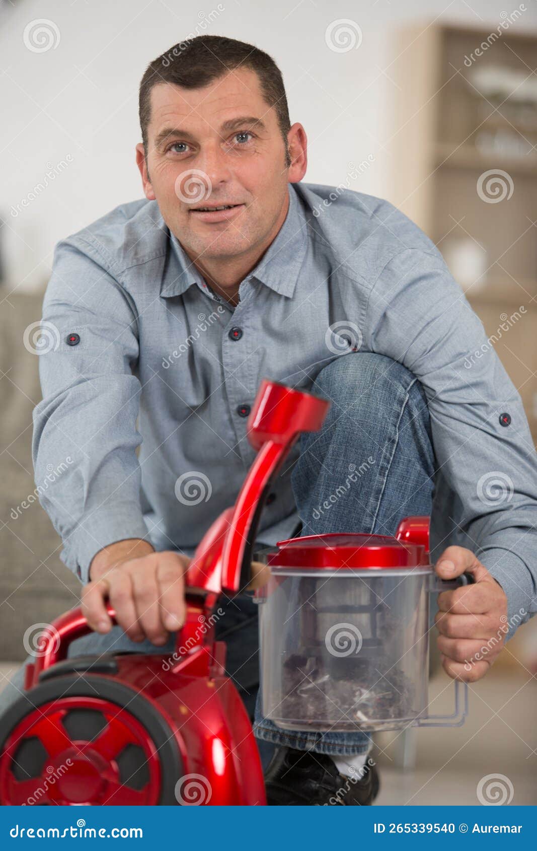 Man Dismantling Vacuum Cleaner To Empty Out Dust Stock Photo Image of