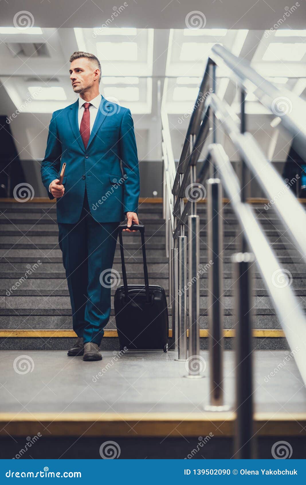 Man with Document and Suitcase Walking on Stairs Stock Photo - Image of