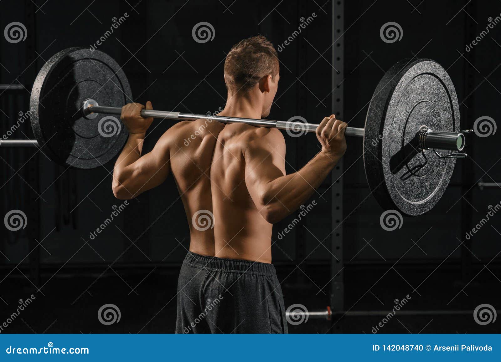 Man Doing Back Squats Exercise with a Barbell Stock Photo Image of