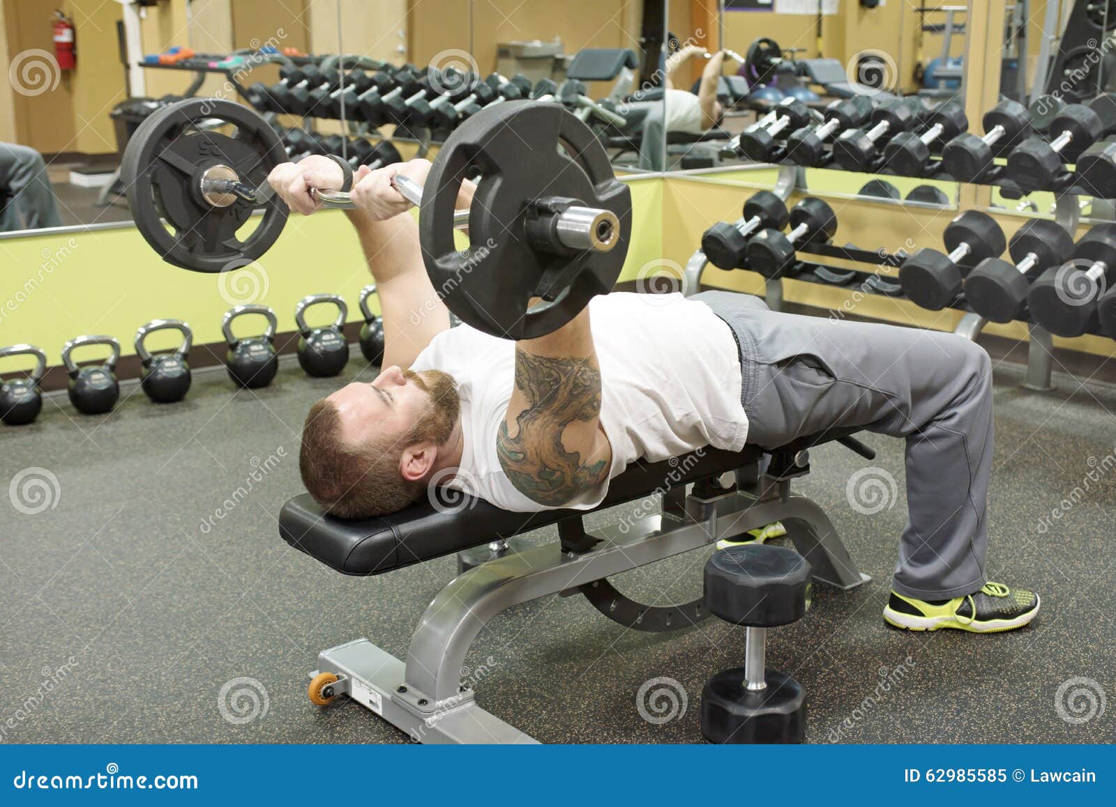 Man Doing E Z Curl Bar Skullcrusher Stock Image Image Of