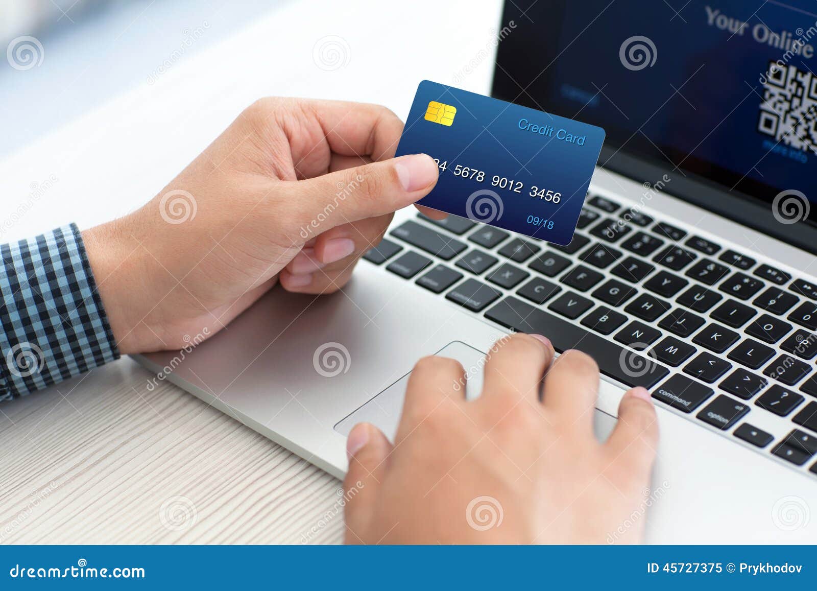 man-doing-online-shopping-credit-card-laptop-45727375.jpg