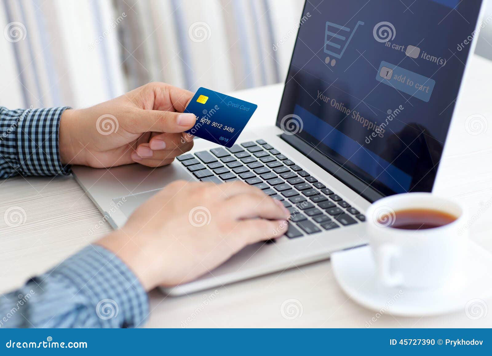 man doing online shopping with credit card on laptop