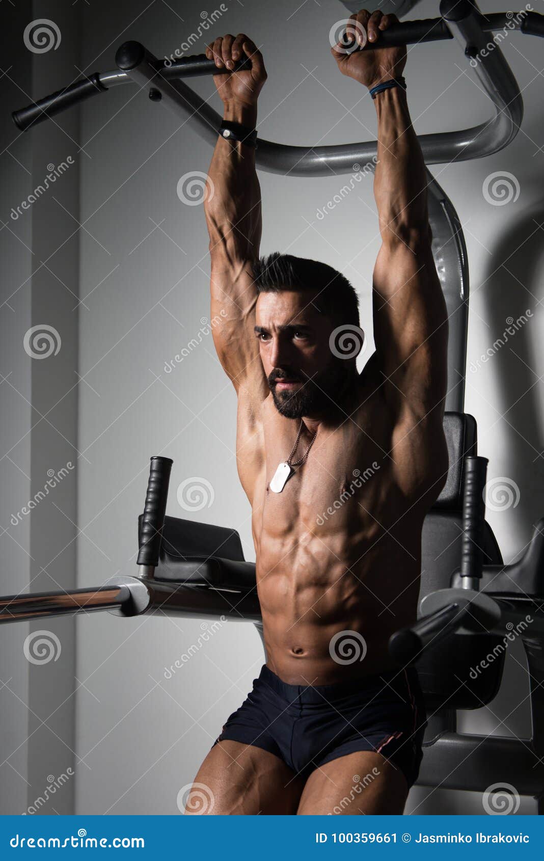 Man Doing Pull-up Bar Abdominal Exercise in Gym Stock Image - Image of  competition, building: 100359661