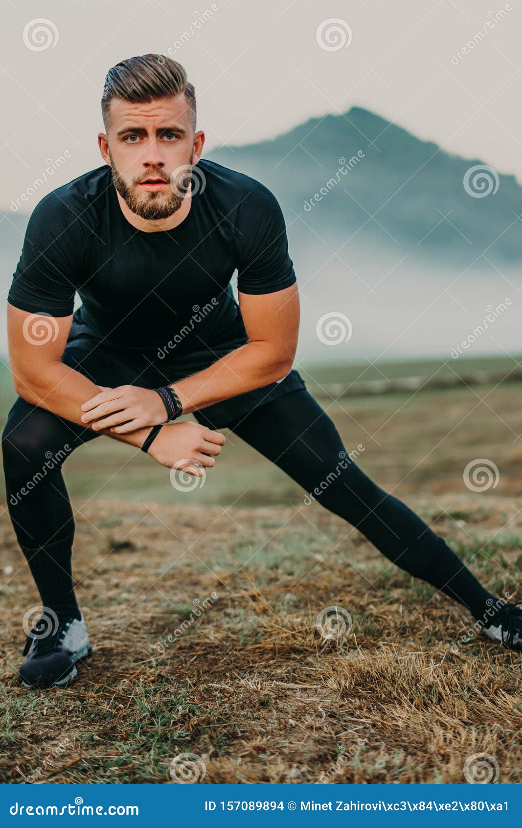 Man Doing Stretching and Preparing for Workout and Running Outdoors ...