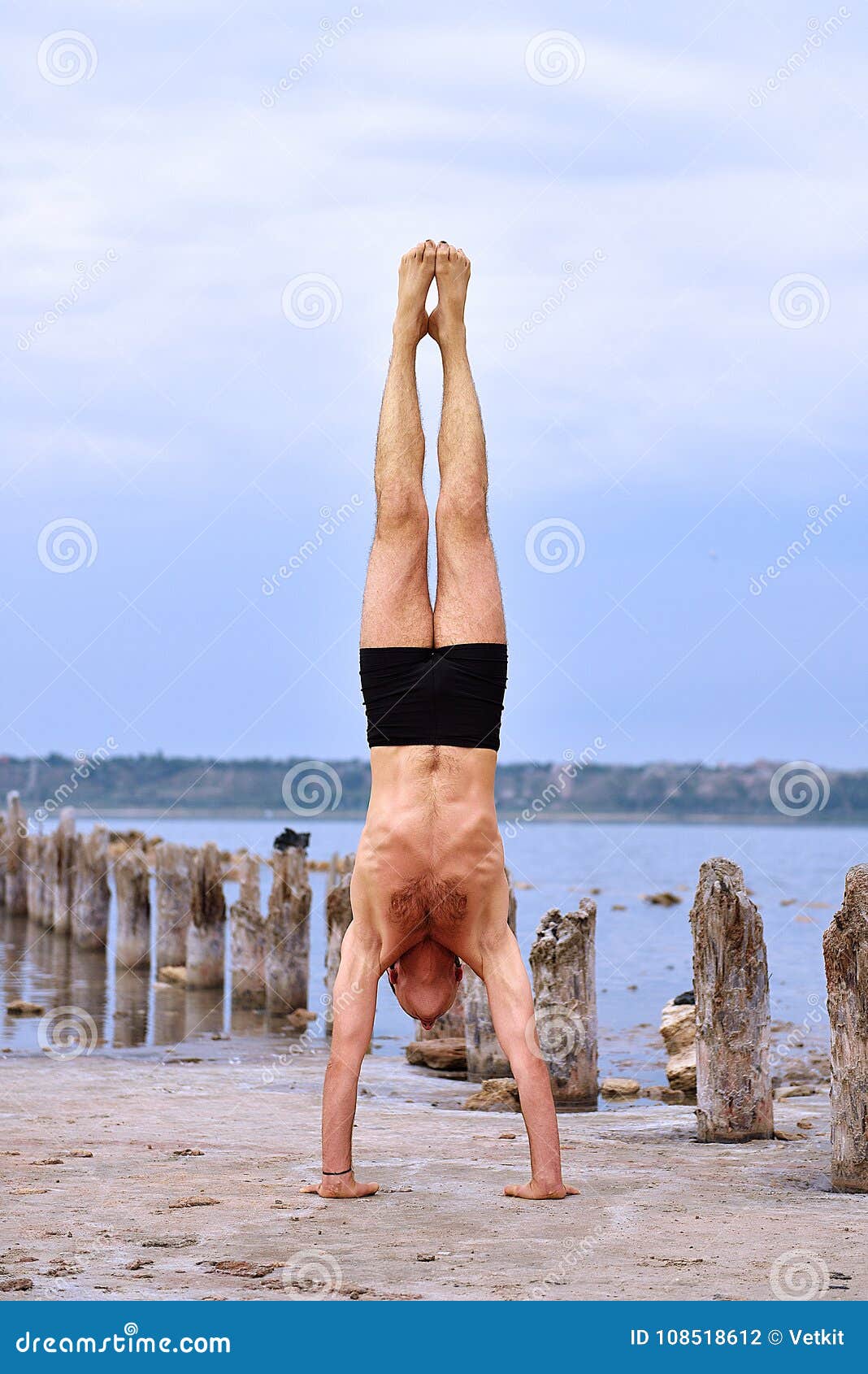 Man Doing Yoga Standing on Hands Stock Photo Image of fresh, ocean