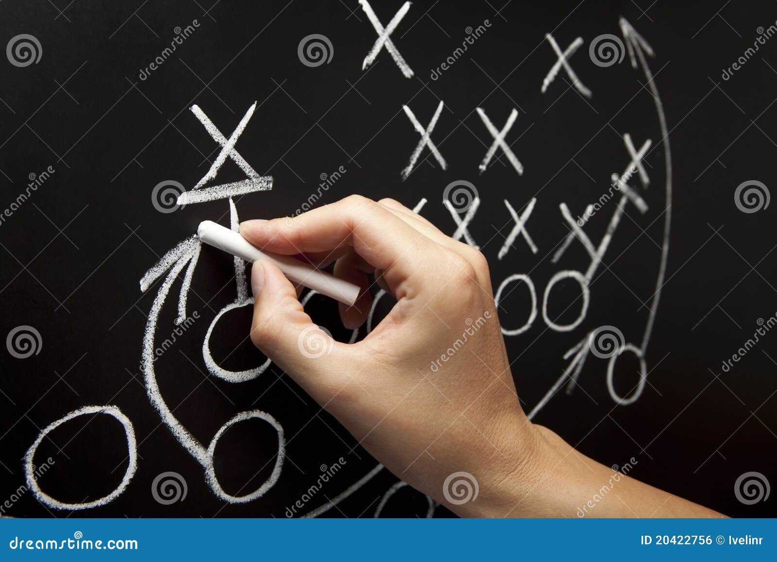 coach drawing american football playbook tactics