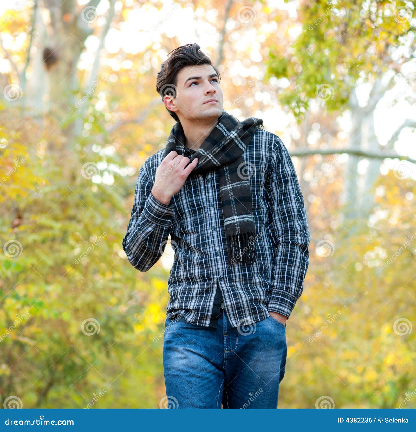 Man Dressed in a Plaid Scarf Walking in Autumn Park. Stock Image ...