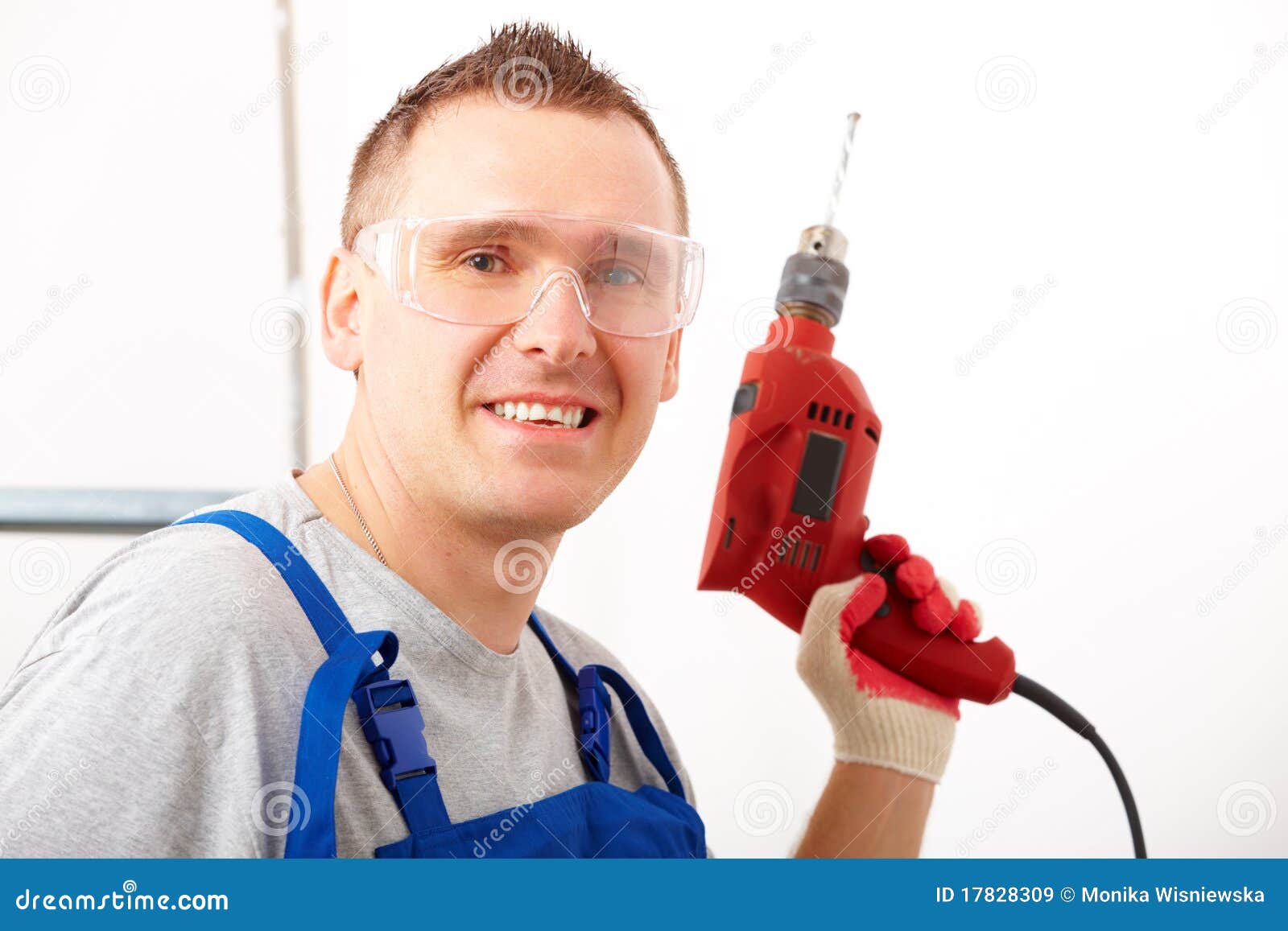 Man with drill stock image. Image of equipment, interior 17828309
