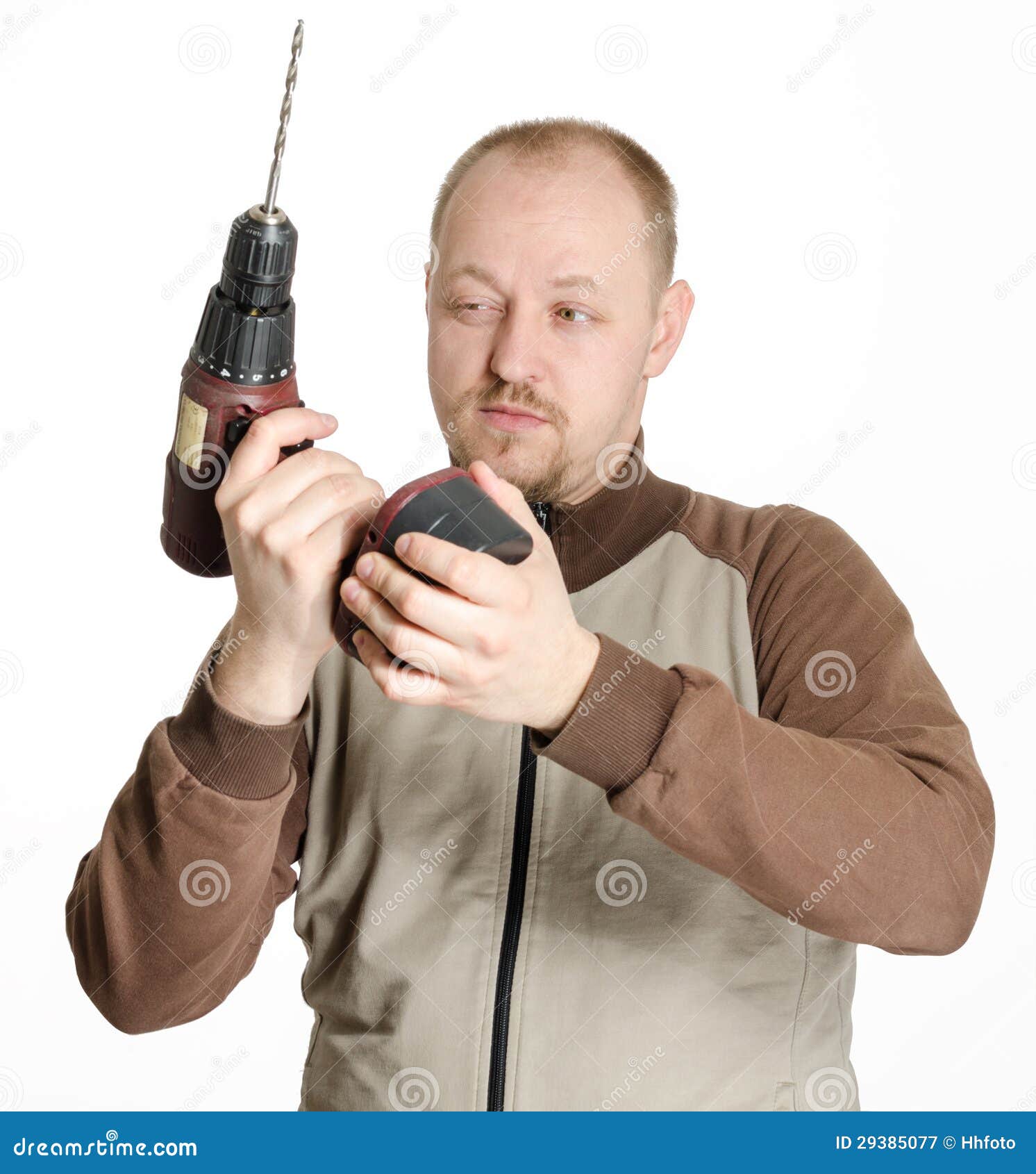 Man with drill machine stock image. Image of confident 29385077