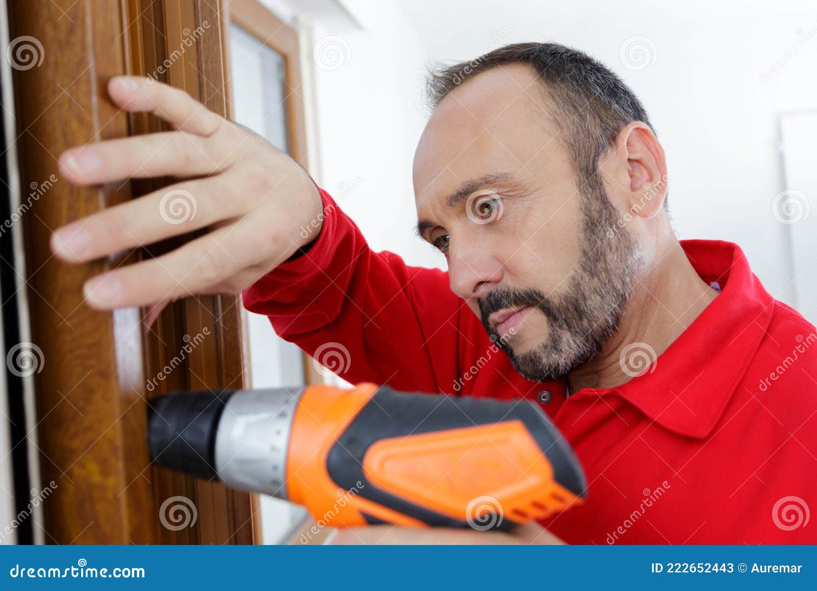 Man Drilling Hole in Wooden Door Stock Image Image of work, power