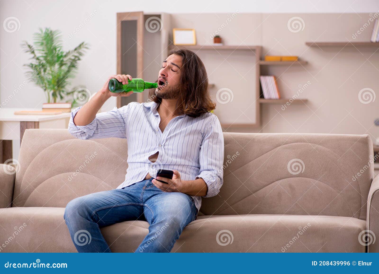 Young Man Drinking Alcohol at Home Stock Photo Image of drunk, bottle 208439996