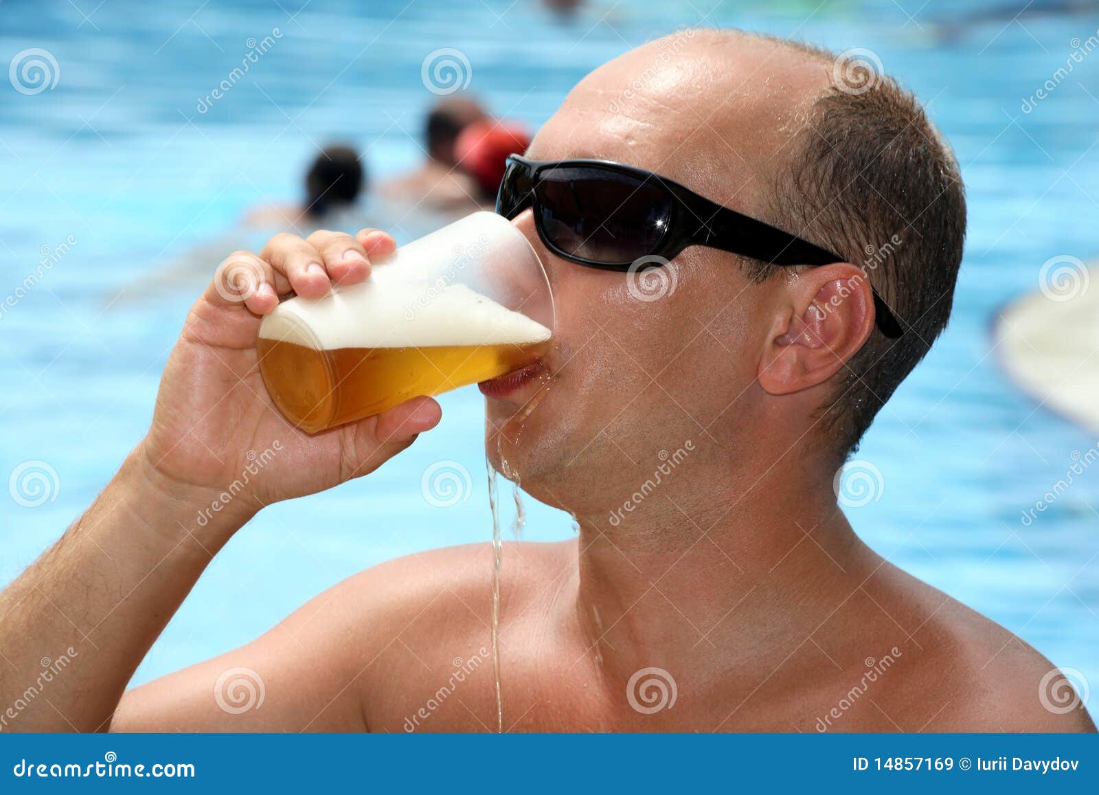 Man Drinking Beer And It Flows In The Face Royalty Free Stock Images