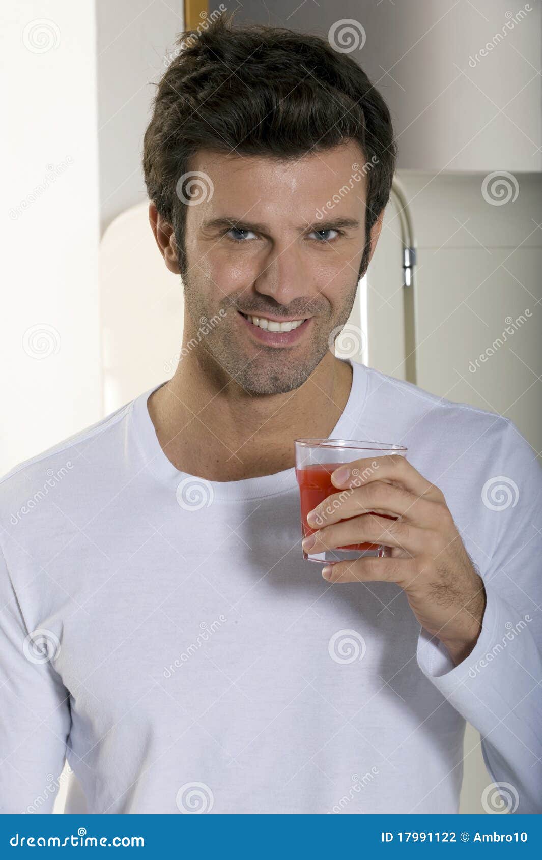 Man drinking orange juice stock photo. Image of indoor - 17991122