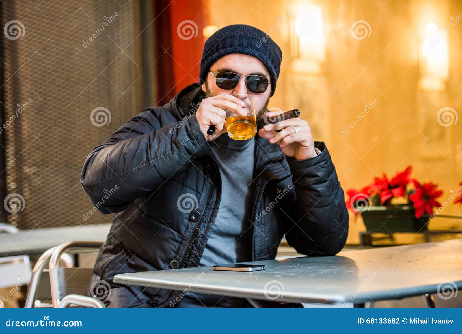 Man Drinking Whisky, Smoking a Cigar Stock Photo Image of blurred