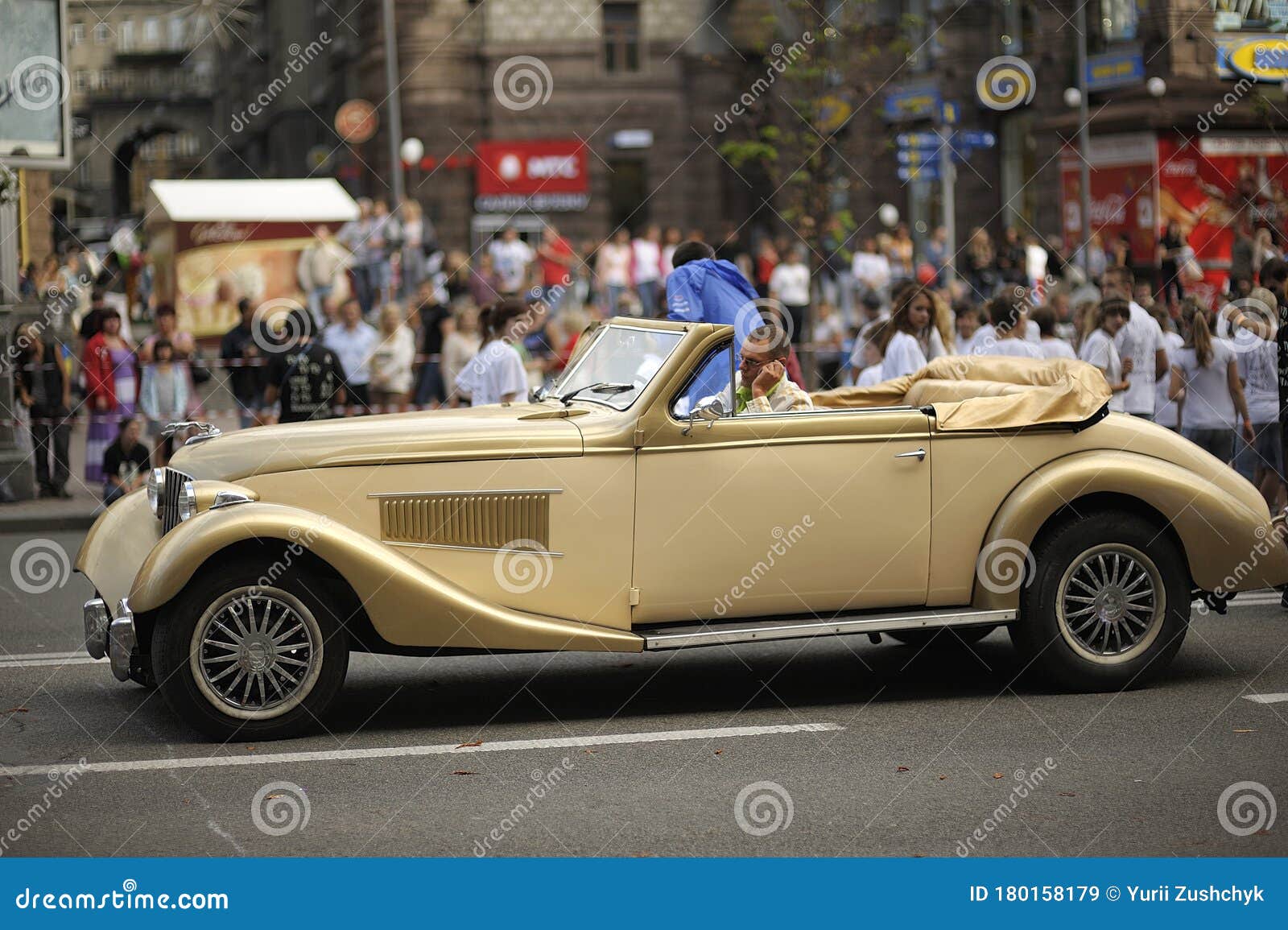 Man, Driver, Sitting in the Retro Car, Crowd of Blurred People on a  Background Editorial Stock Image - Image of blue, urban: 180158179