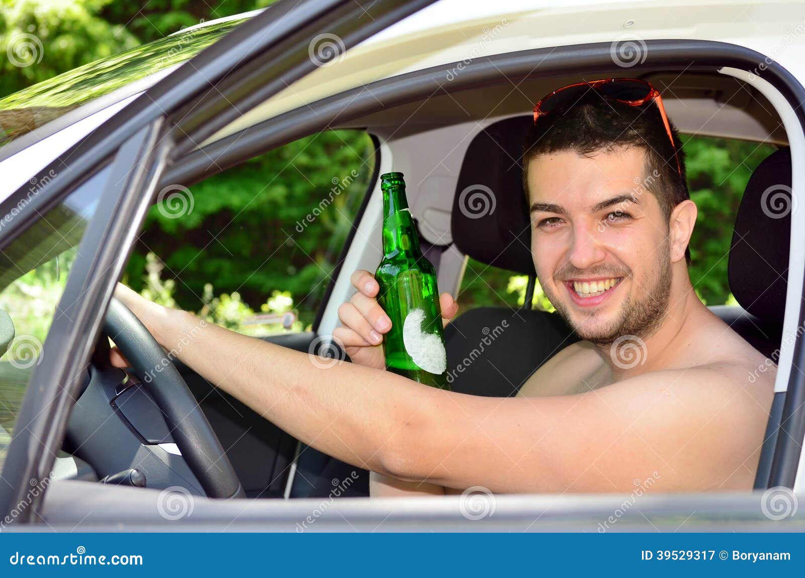 Man Driving Car with Beer in Hand Stock Image Image of male, driving