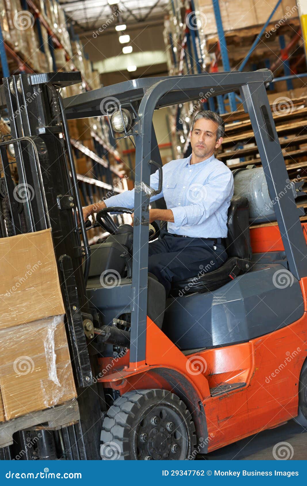Man Driving Fork Lift Truck in Warehouse Stock Photo Image of driving