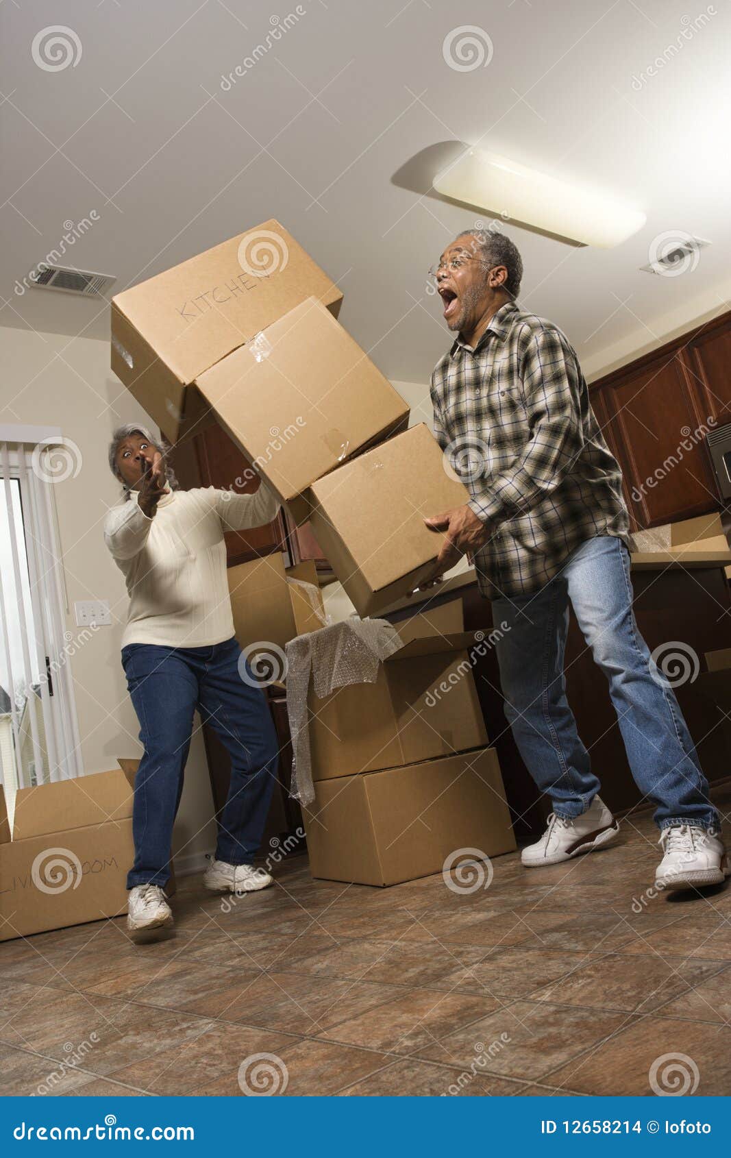 man dropping stack of boxes