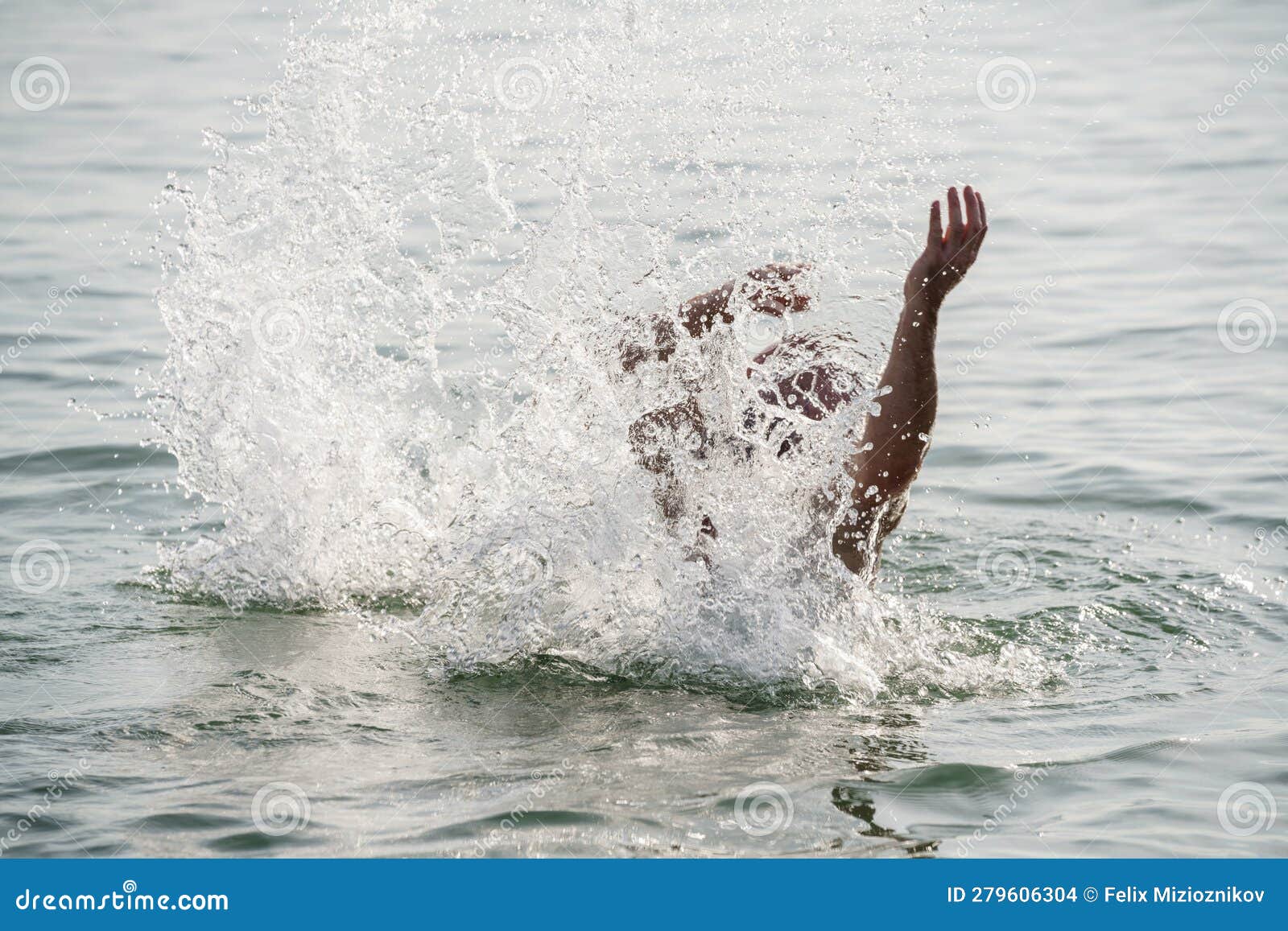 Man drowning in the ocean stock photo. Image of danger - 279606304