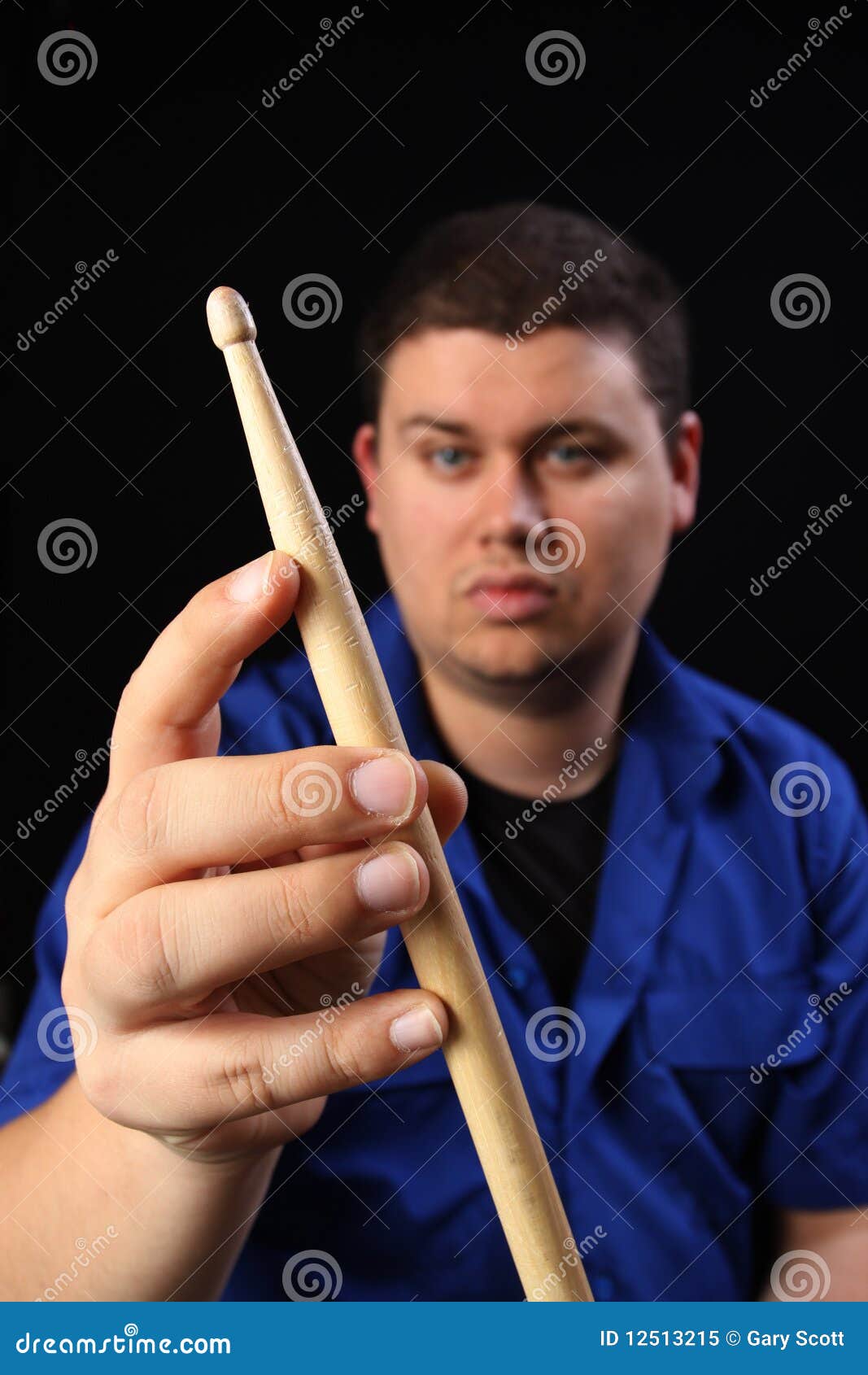 Man with Drumstick left stock image. Image of drum, music 12513215