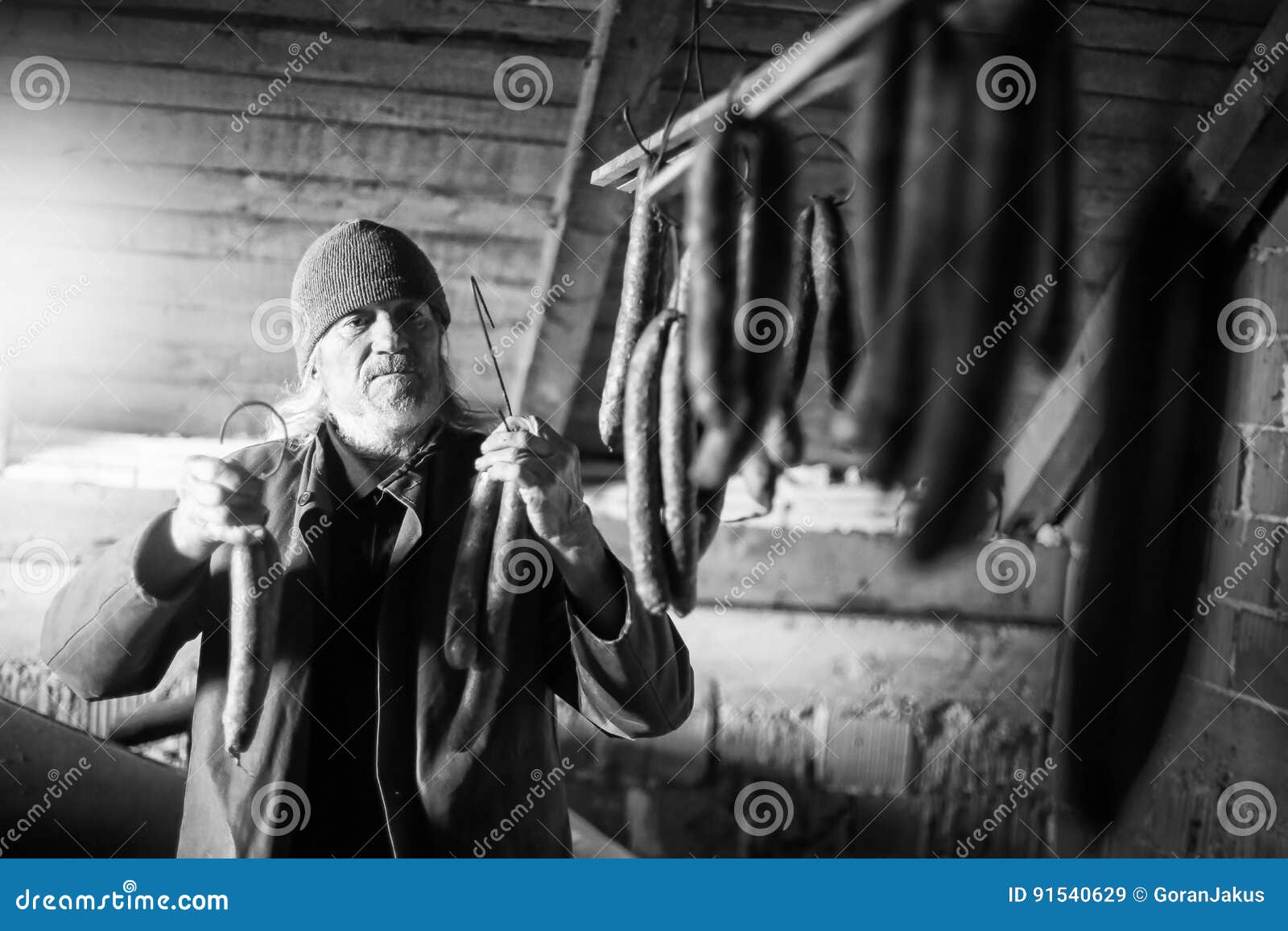 Man drying sausages bw stock image. Image of front, mature 91540629