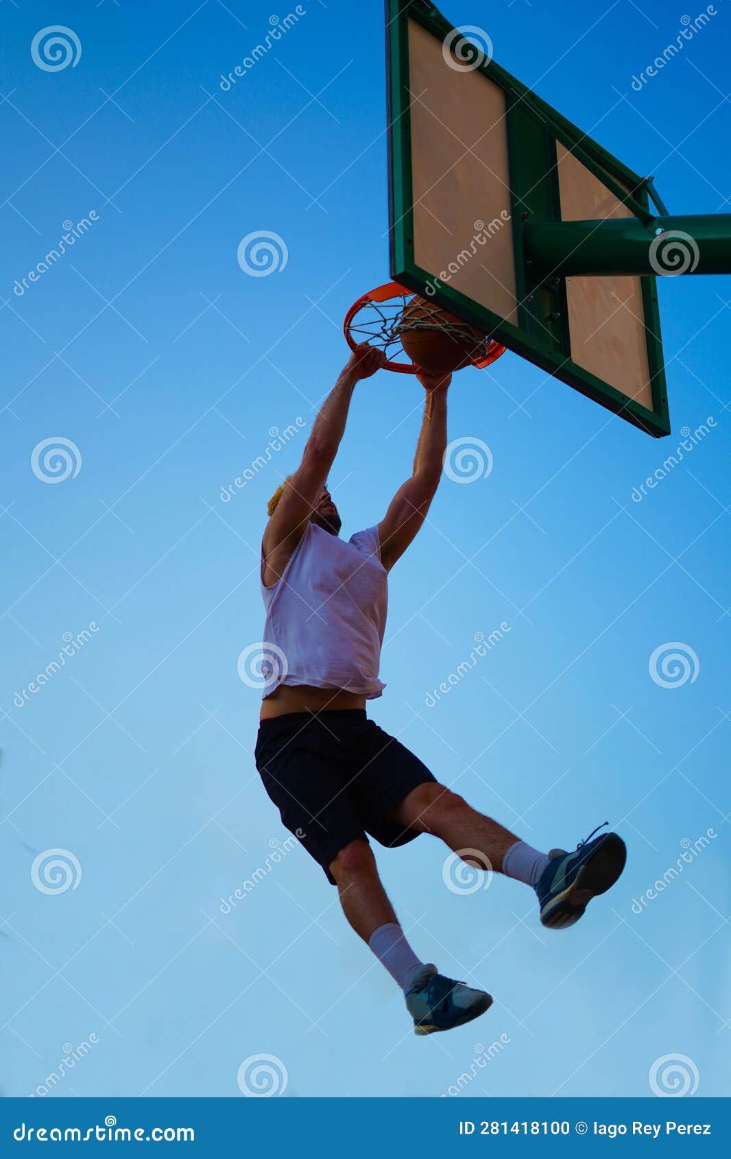 Man Dunking in a Basket Over Blue Sky Stock Photo Image of practicing