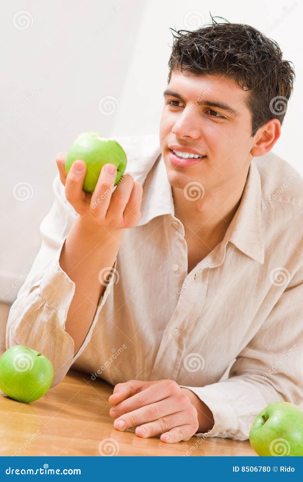 Man eating apples stock photo. Image of floor, lifestyle 8506780