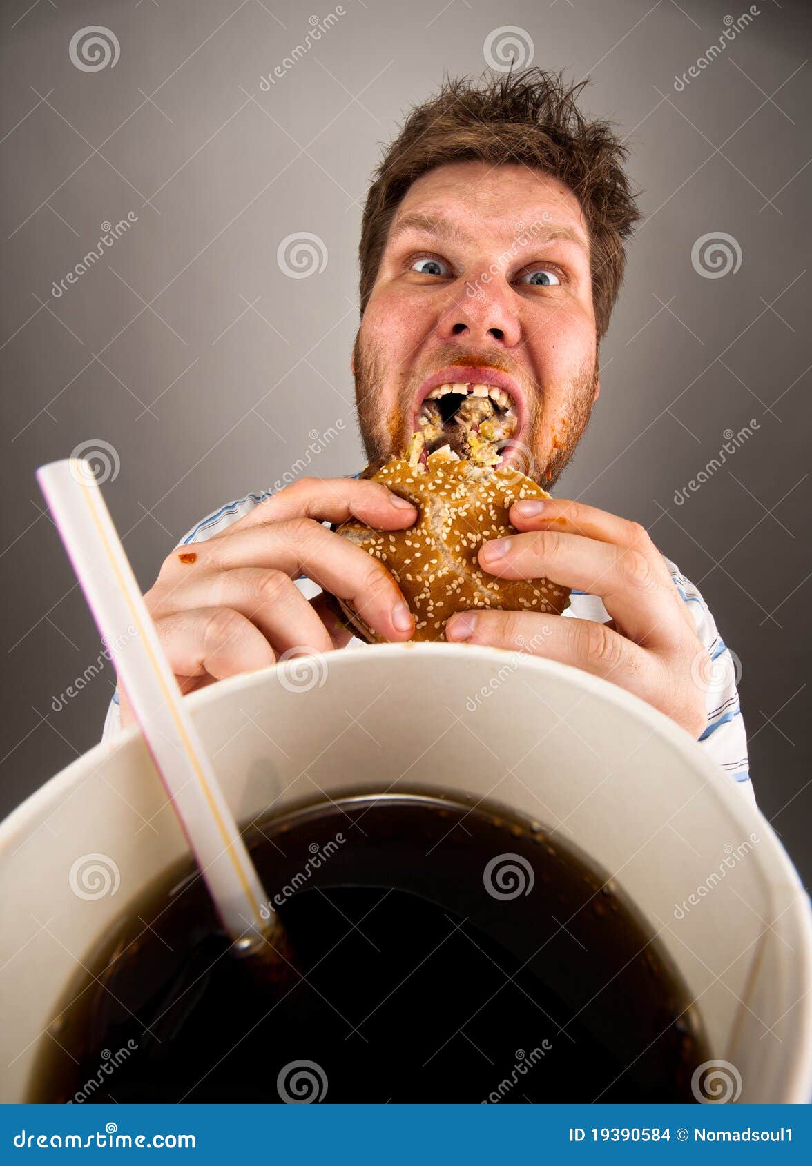 Man eating fast food stock photo. Image of juicy, hunger - 19390584