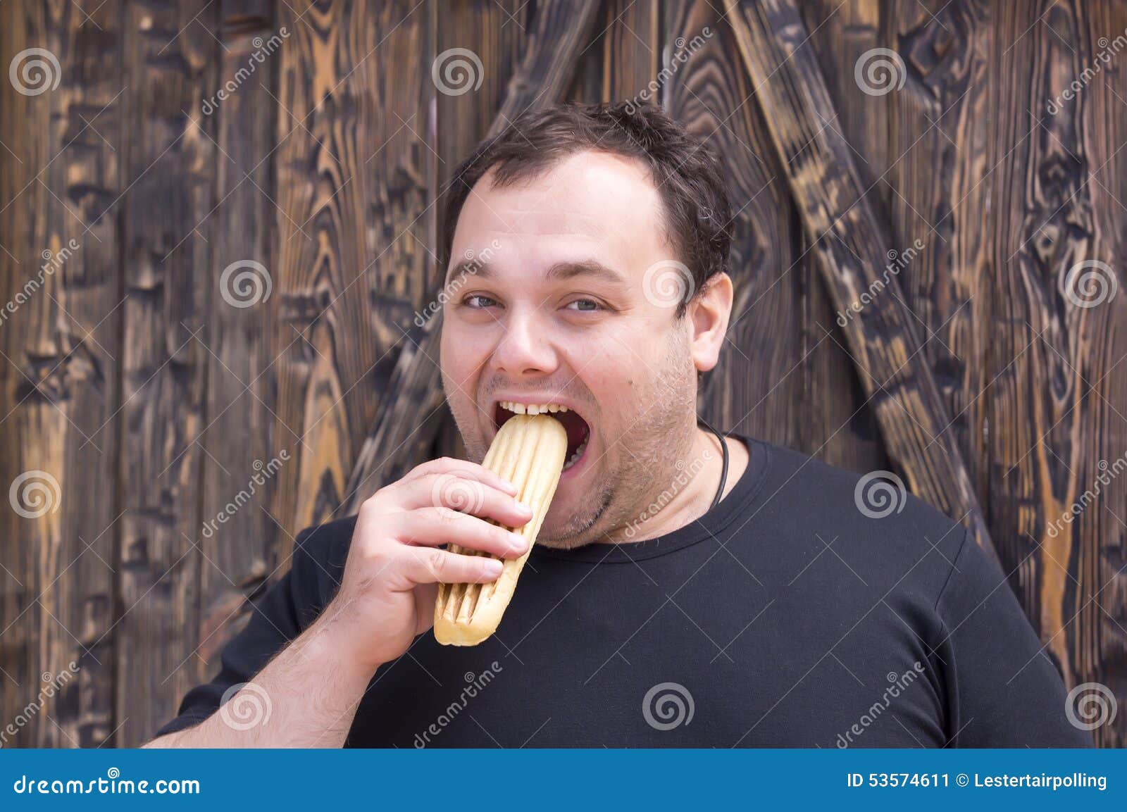 Man eating a hot dog stock image. Image of hungry, expression 53574611
