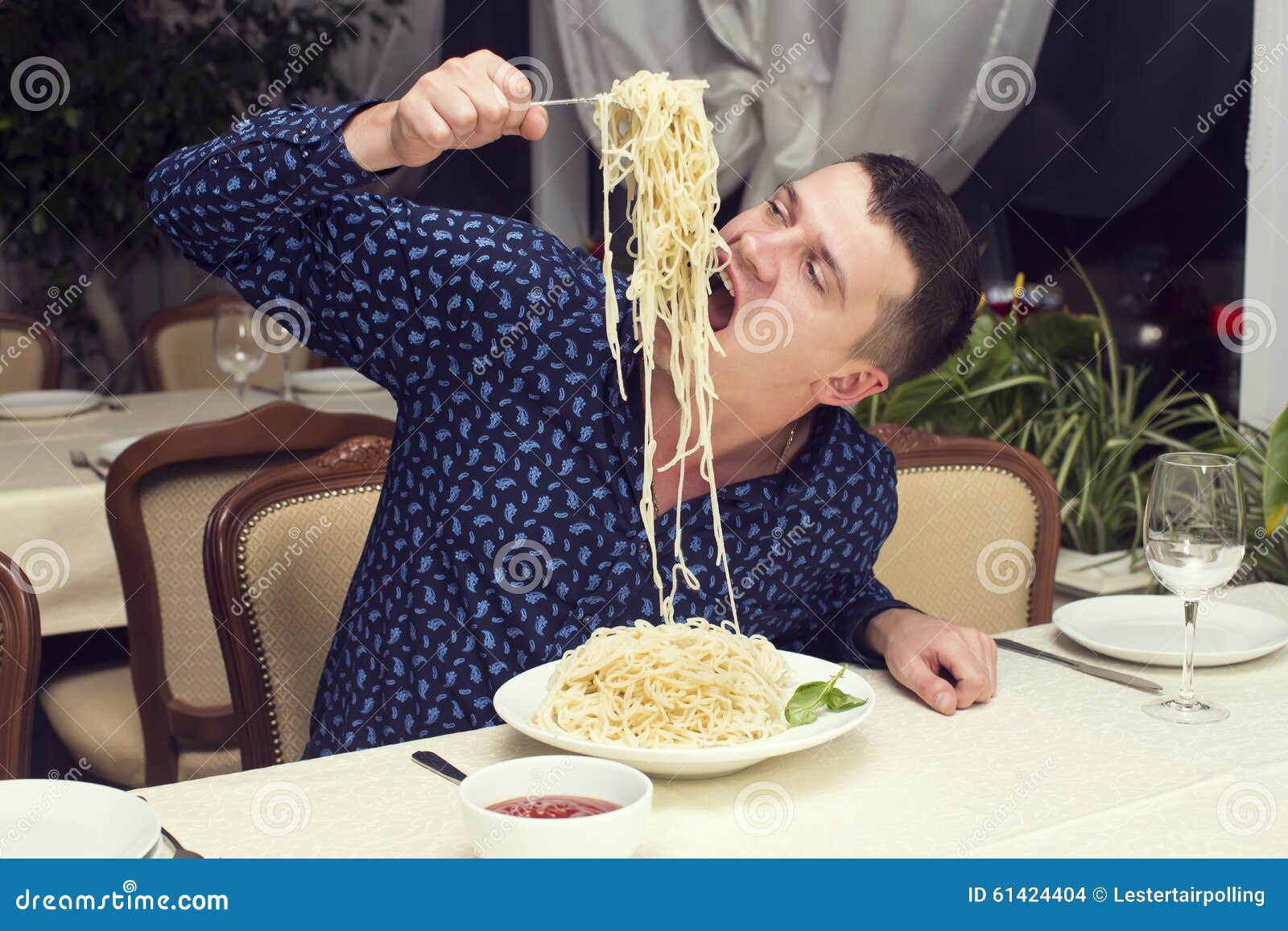 Man Eating a Large Portion of Pasta Stock Photo Image of fish, camera