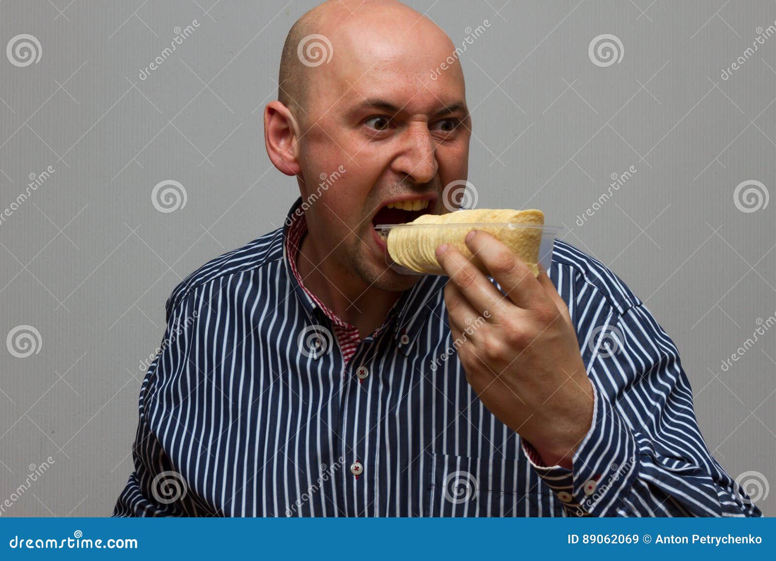 Man Eating Potato Chips Hurriedly Stock Image Image of chips