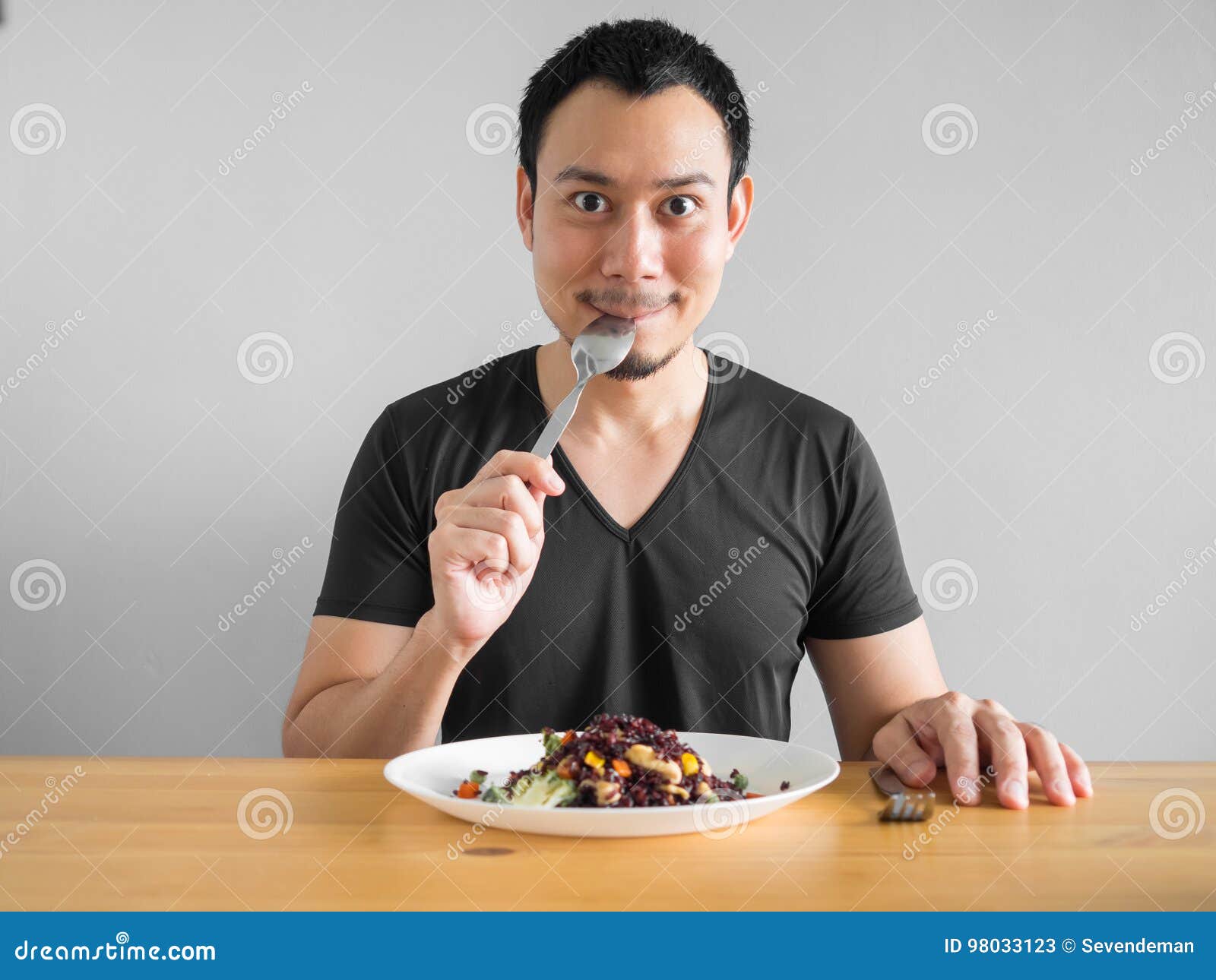 Man eats healthy food. Asian man eats clean food for good healthy life.