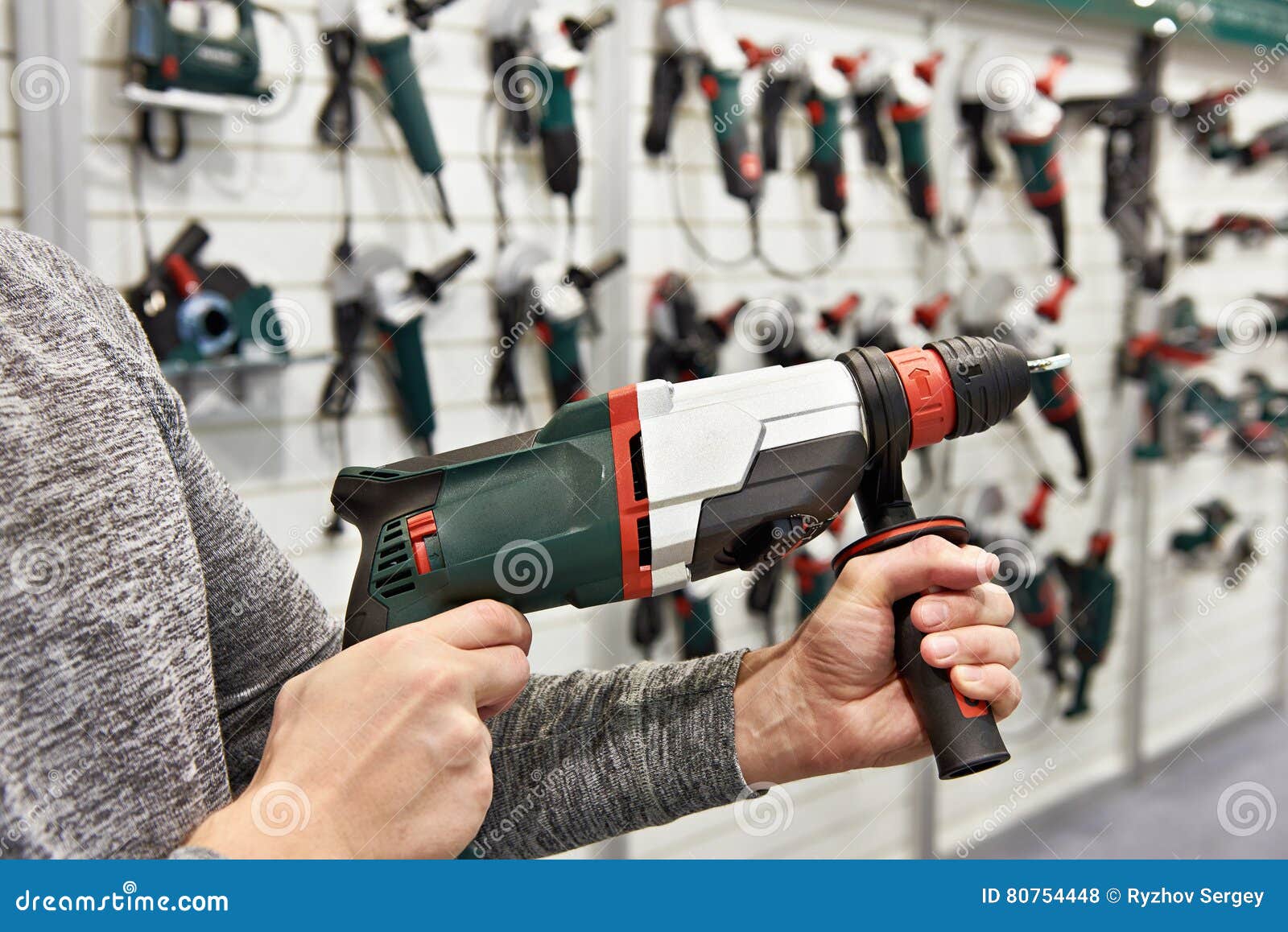 Man with Electrical Hammer Drill in Hardware Store Stock Photo Image