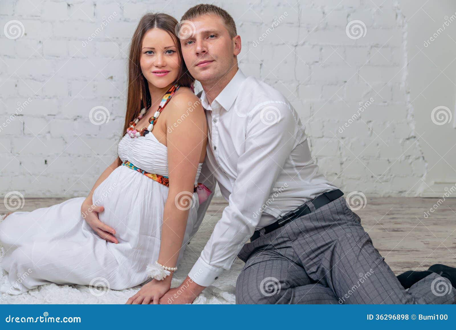 Man is Embracing His Pregnant Wife Stock Photo pic