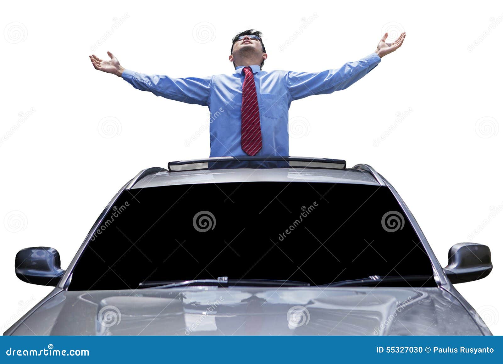 man enjoy freedom on the sunroof of car