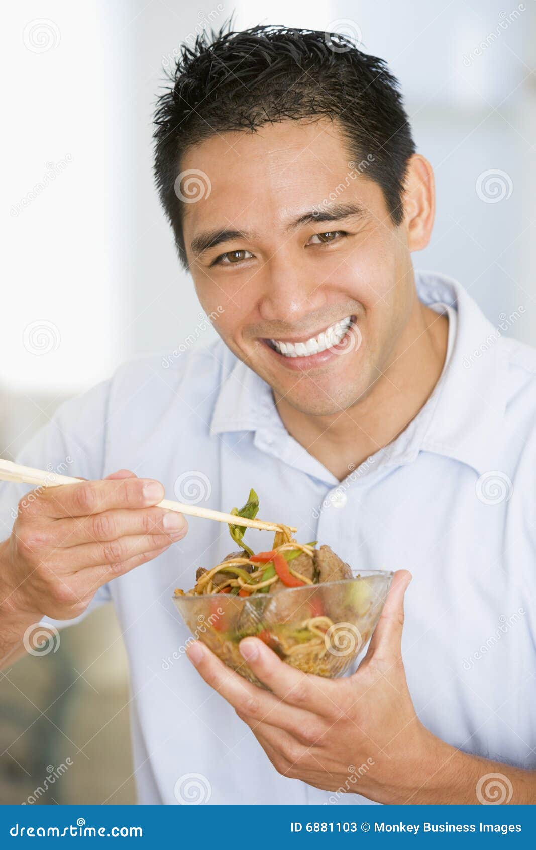 Man Enjoying Chinese Food with Chopsticks Stock Image Image of happy