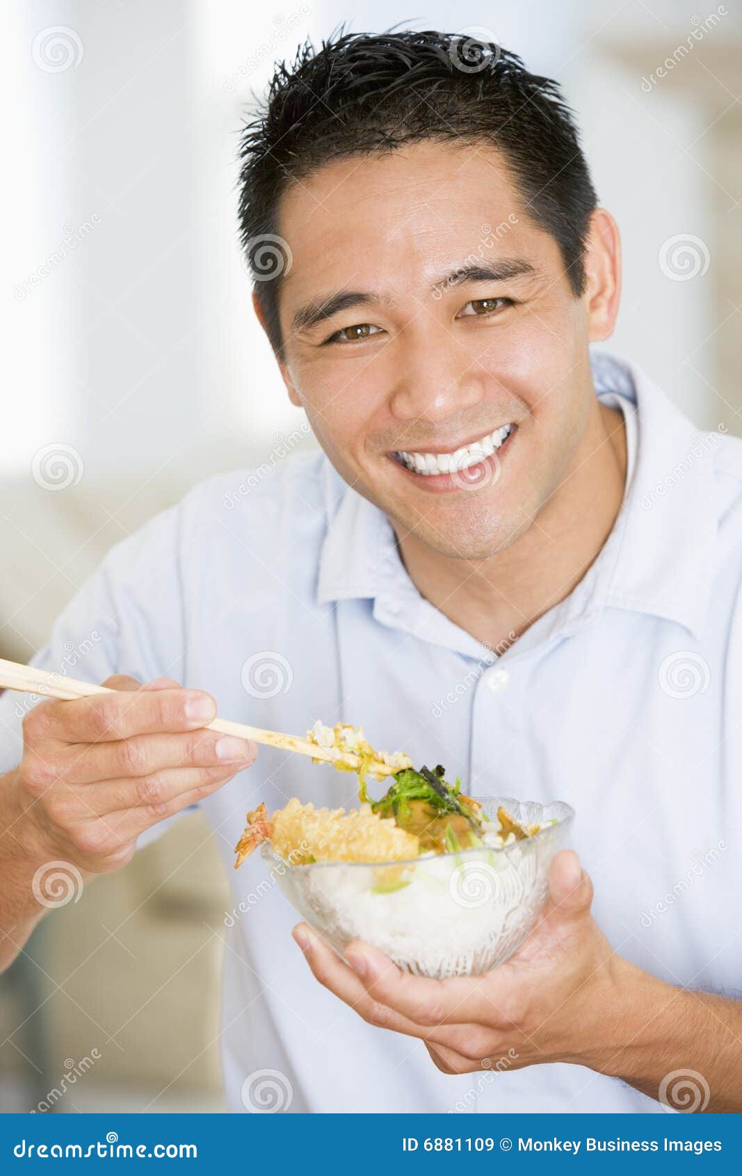 Man Enjoying Chinese Food with Chopsticks Stock Image Image of
