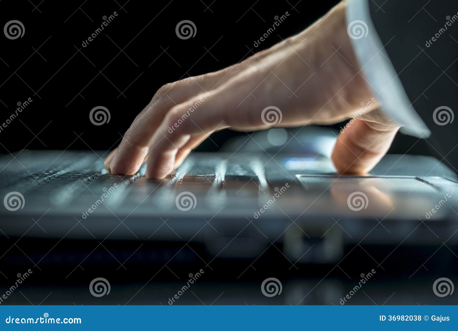 Man Entering Data on His Laptop Computer Stock Photo Image of