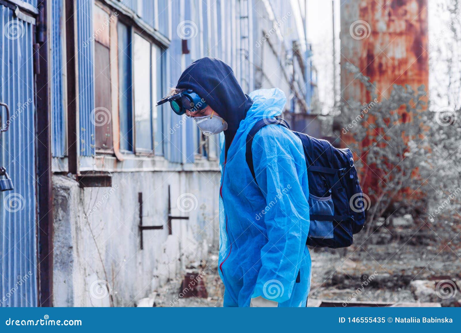 man environment mask face pack disguise facemask bitmask protective overall blue orange rast plant factory disused catastrophe